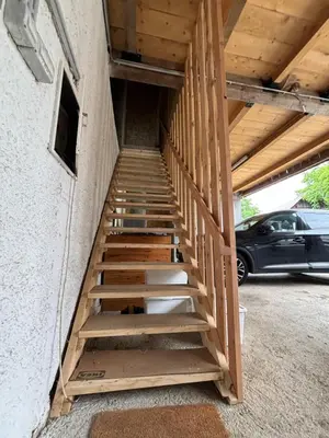 a staircase leading up to a building with a car at Turistična kmetija Pod kostanji - FarmStay Pod kostanji in Motnik