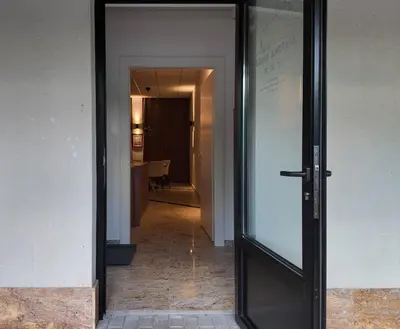 a hallway with a glass door leading to a room at Luxury Apartment Simba C in Smarjeske Toplice