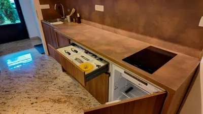 a kitchen with a stove and a counter top at Luxury Apartment Simba C in Smarjeske Toplice