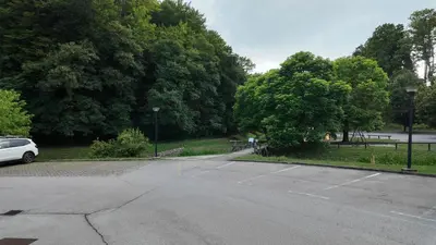 a parking lot with a car parked in a park at Luxury Apartment Simba C in Smarjeske Toplice