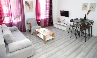 a living room with a couch and a table at Villa Volk in Ilirska Bistrica