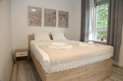 a bedroom with a bed with two towels on it at Villa Volk in Ilirska Bistrica