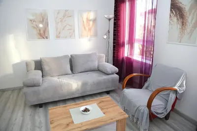 a living room with a couch and a coffee table at Villa Volk in Ilirska Bistrica