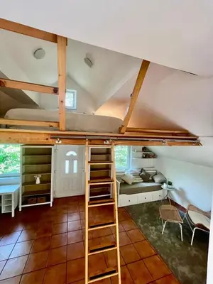 a room with a bunk bed and a ladder at Nature and City Access - Perfect Base in Ljubljana in Ljubljana