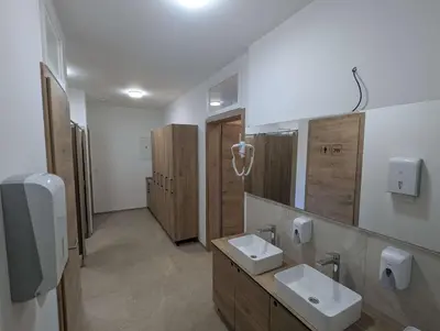 a bathroom with two sinks and two mirrors at Štuhecova domačija