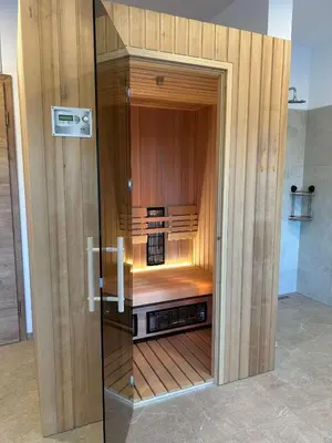 a wooden cabinet with a kitchen inside of it at Štuhecova domačija