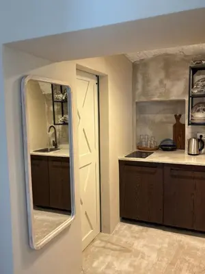 a kitchen with a sink and a mirror at Vida's homes in Ljubljana