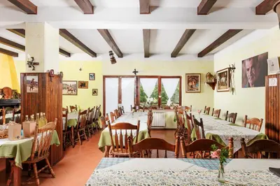 a large dining room with tables and chairs at Ranč Katja in Abdul in Materija
