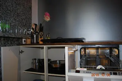 a kitchen with an oven with pots and pans at Apartment Center 25 in Ljubljana