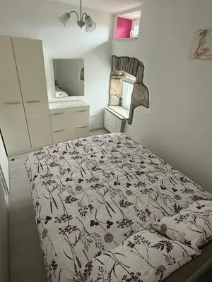 a bedroom with a bed and a dresser in it at House Mohar in Lokev