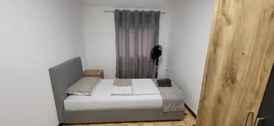 a small bedroom with a bed in a room at Apartma Viković