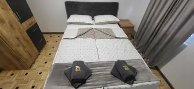 a pair of beds in a room withskirts at Apartma Viković