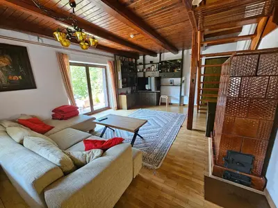 a living room with a couch and a table at Chalet 61 Lake Jasna in Kranjska Gora
