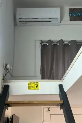 a window in an rv with a sign on it at CC Vič in Ljubljana