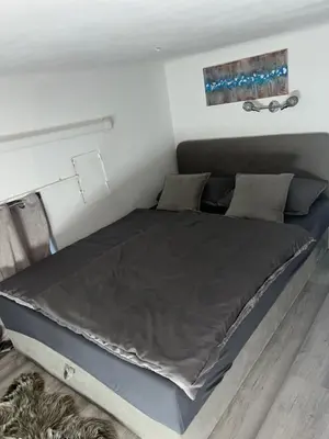 a large bed in a room with at CC Vič in Ljubljana