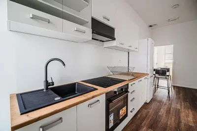 a kitchen with a sink and a counter top at Comfort Rooms Obrežje by Highway, Free Covered Parking in Jesenice na Dolenjskem
