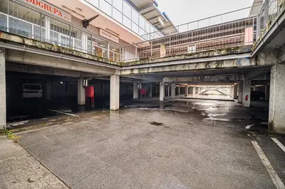 an empty parking lot in an old building at Comfort Rooms Obrežje by Highway, Free Covered Parking in Jesenice na Dolenjskem