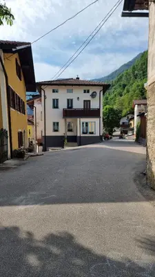 an empty street in front of a building at Hiša Nad Reko Baca in Most na Soči