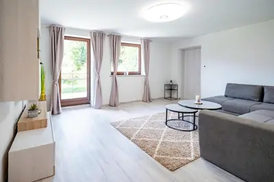 a living room with a couch and a table at Apartments Lian in Bled