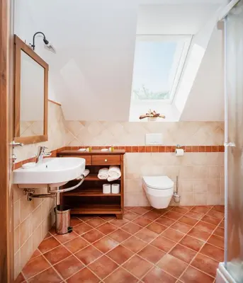 a bathroom with a sink and a toilet at Gostilna in picerija Harlekin in Ribnica