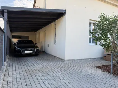 a car parked in a garage next to a building at City Nest Ljubljana - Terrace & Free Parking in Ljubljana