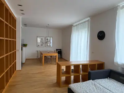 a living room with a couch and a table at City Nest Ljubljana - Terrace & Free Parking in Ljubljana