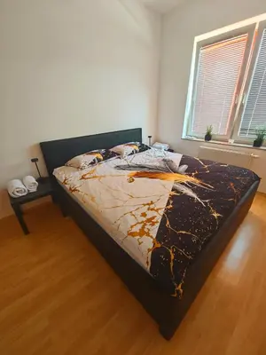 a bedroom with a bed in a room at Soba Amaris bianco in Benedikt v Slovenskih Goricah