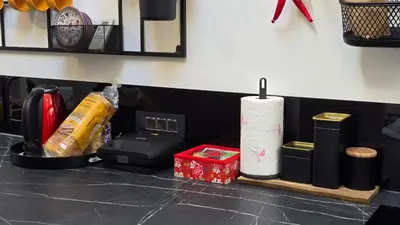 a counter top with a roll of paper towels and other items at Funky Stylish Penthouse in Ljubljana