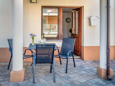 a table and chairs sitting on a patio at Apartment Adelsberg Inn-2 by Interhome in Postojna