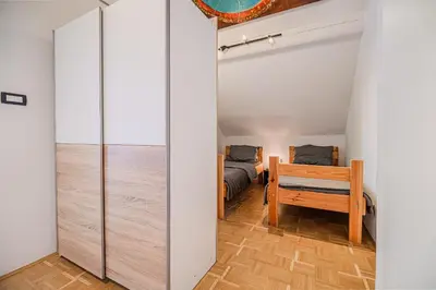a room with a sliding door leading to a bedroom at 4 Bedroom Villa with Heated Indoor Pool Jajo & Pajo in Fala