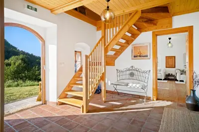 an external view of a house with a staircase at Old Castle Lodge in Kamnik