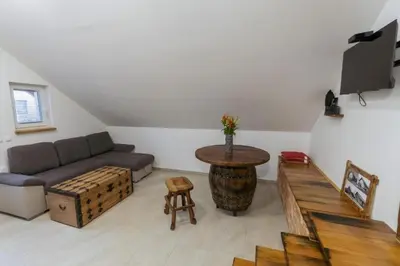 a living room with a couch and a table at APARTMA Viktor in Ormoz