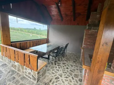 a dining room with a table and chairs and a window at APARTMA Viktor in Ormoz