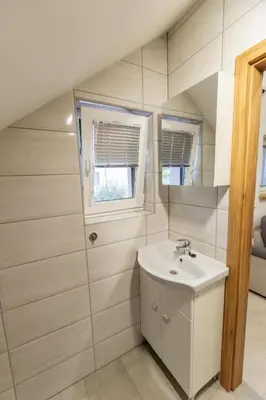 a bathroom with a sink and a mirror at APARTMA Viktor in Ormoz
