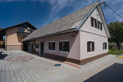 a building with the number on the side of it at Hiša Varleh in Mengeš