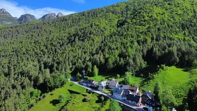an aerial view of a house in a mountain at Apartment Pohar in Log pod Mangartom