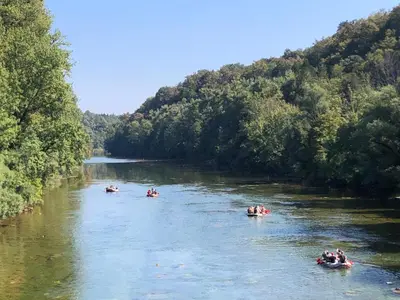 a group of people rafting down a river at Kamp Jankovic in Gorenjcj