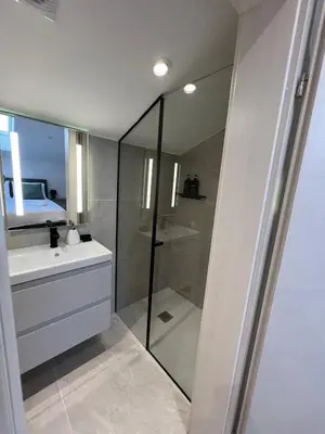 a bathroom with a glass shower and a sink at Mountain Escape with Sauna in Kobarid
