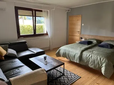 a living room with two beds and a couch at Apartma Grahor in Selnica ob Dravi