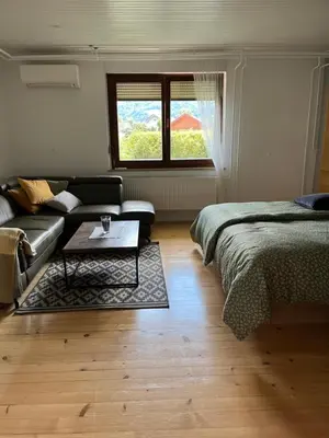 a living room with a couch and a table at Apartma Grahor in Selnica ob Dravi
