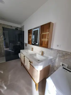 a bathroom with a sink and a shower at Domačija Rajsko srce in Šentjur