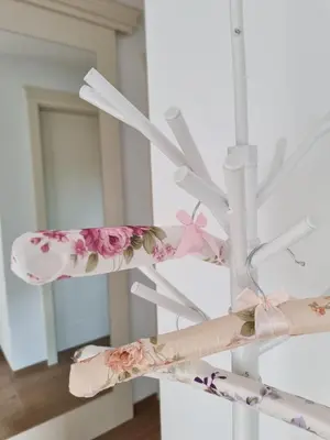 a white ceiling fan with pink flowers on it at Domačija Rajsko srce in Šentjur