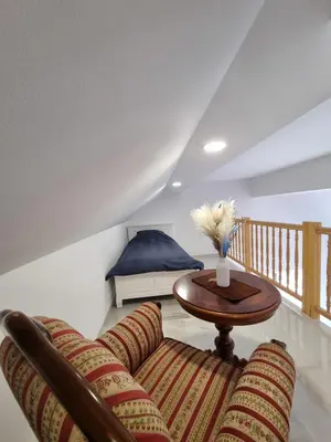 a living room with a couch and a table at Domačija Rajsko srce in Šentjur