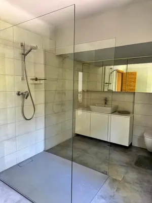 a bathroom with a shower and a sink at Cozy Mountain Stay near Kranjska Gora in Gozd Martuljek