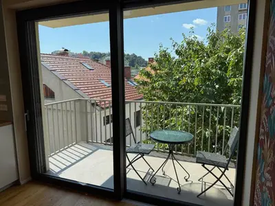 a view of a balcony with a table and chairs at Crown Residence Luxury 2BR in Ljubljana Downtown in Ljubljana