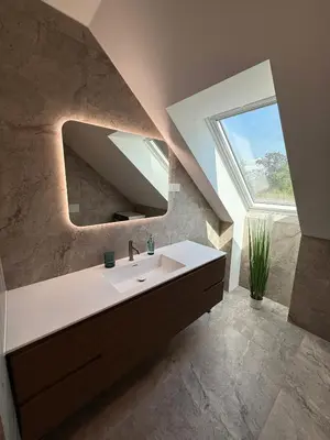 a bathroom with a sink and a mirror and a window at Crown Residence Luxury 2BR in Ljubljana Downtown in Ljubljana