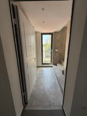 a hallway with a door leading to a bathroom at Crown Residence Luxury 2BR in Ljubljana Downtown in Ljubljana