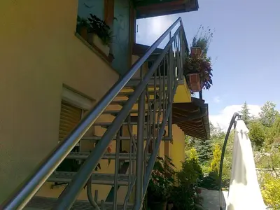 a metal staircase leading up to a building at Apartma 