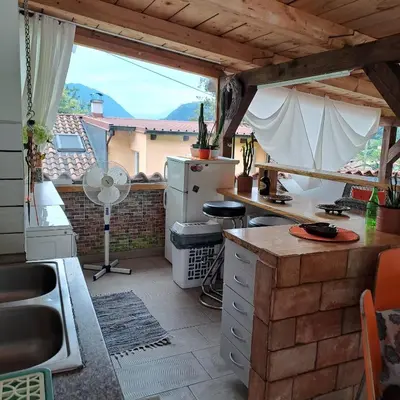 a kitchen with a counter top and a window at Hiša Gadiča in Tolmin