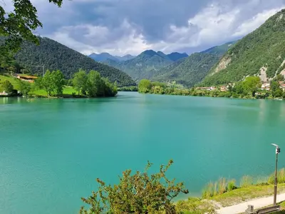 a view of a lake with mountains in the background at Hiša Gadiča in Tolmin